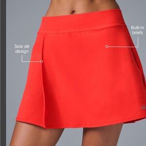 Alo Yoga Women's Alosoft Backspin Skirt in a bright red medium